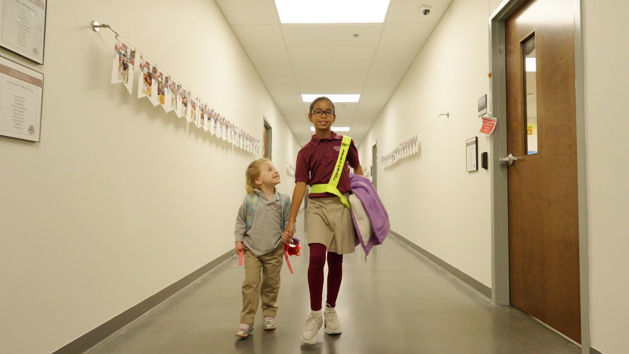 Students walking down a hallway at one of the schools we serve